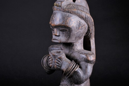 Lot 48 - A Fang Byeri figure, Gabon, with long coiffure,...