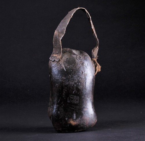 Lot 54 - An African carved wood miniature mask/bell,...