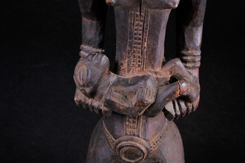 Lot 51 - A carved wood Bembe standing maternity figure,...