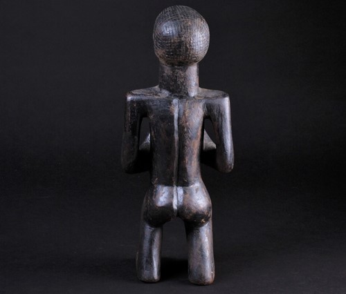 Lot 38 - An East African standing male fertility figure,...