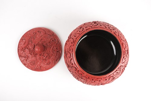 Lot 216 - Early 20th c. Chinese carved red lacquer,...