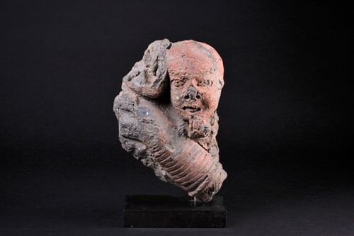 Lot 12 - An African terracotta bust of a child, an arm...