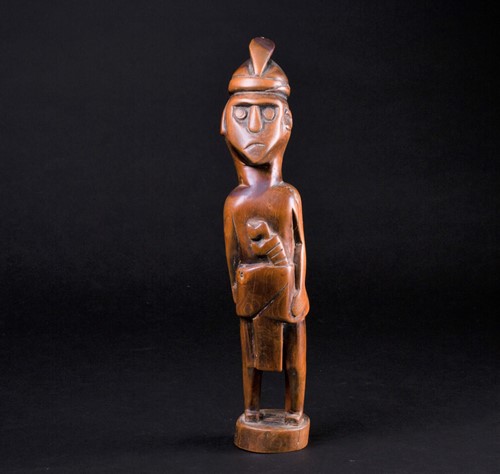 Lot 32 - A Malaysian carved wood standing figure of a...