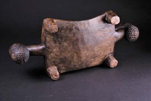 Lot 68 - A Chokwe carved wood head rest, in the form of...
