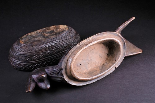 Lot 19 - A Yoruba carved wood box in the form of a bird,...