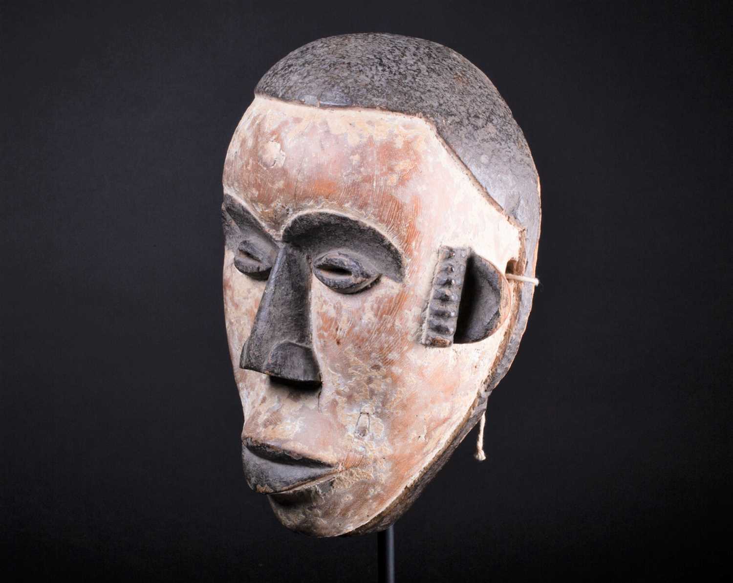 Lot 13 - An Igbo mask, Nigeria, with short coiffure,...