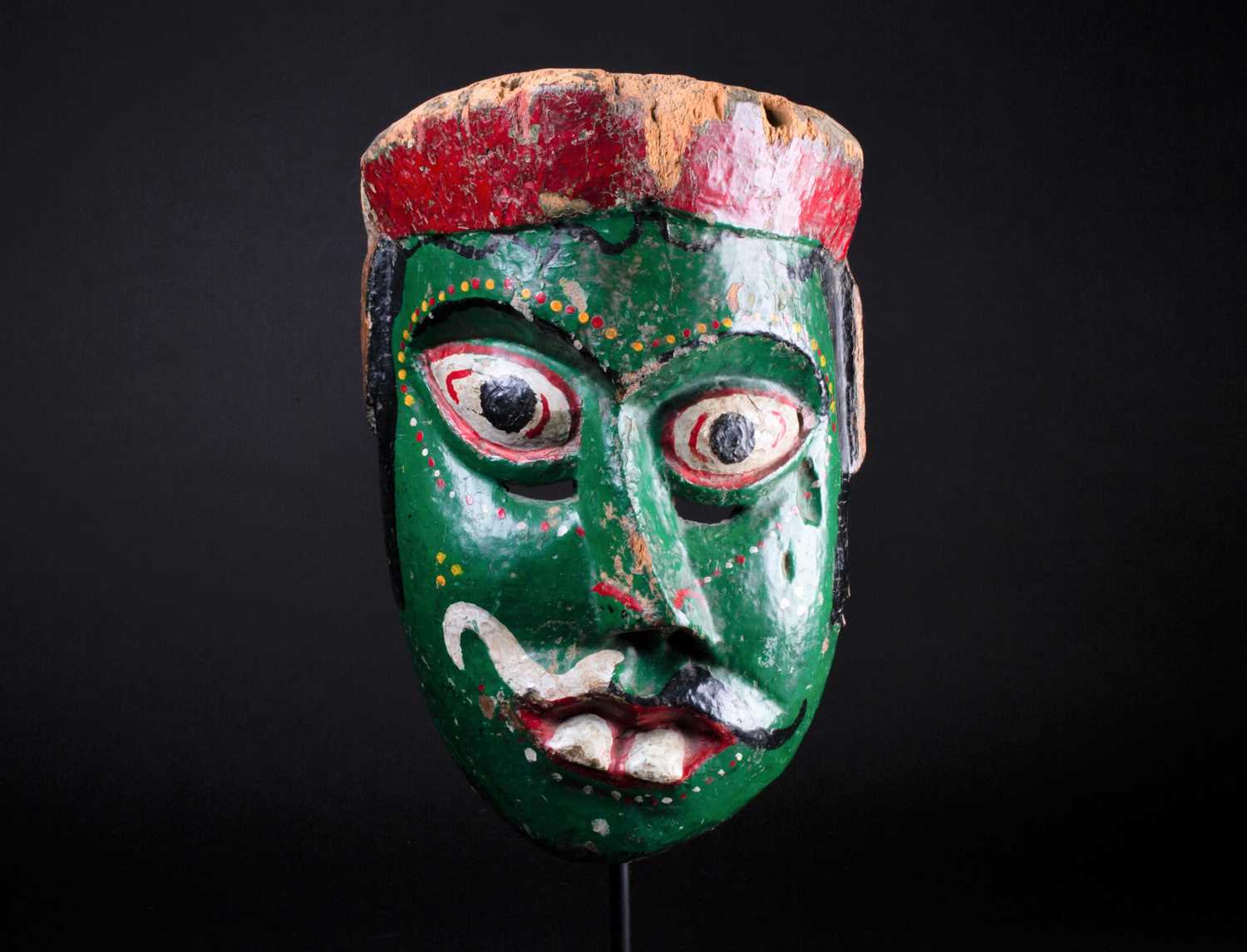 Lot 56 - An Indonesian carved and painted wood sickness...