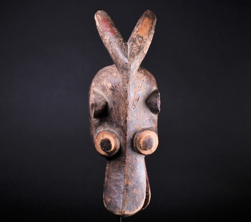Lot 69 - A Mambila zoomorphic mask, Cameroon, with red...
