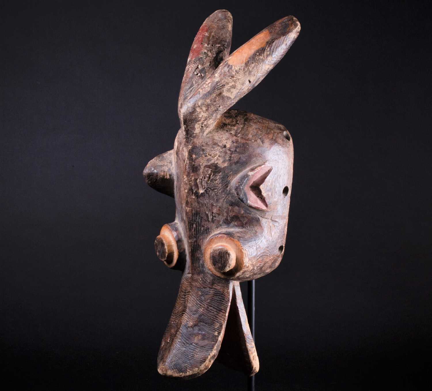 Lot 69 - A Mambila zoomorphic mask, Cameroon, with red...