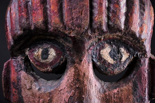 Lot 14 - A carved and painted wood zoomorphic mask,...