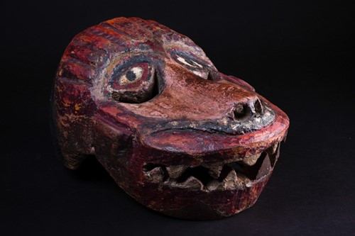 Lot 14 - A carved and painted wood zoomorphic mask,...