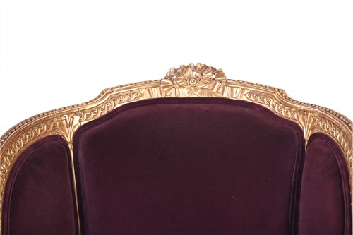 Lot 105 - A French carved, gilded and upholstered...