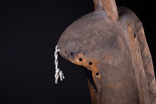 Lot 34 - A Dogon mask, Mali, surmounted by a large bird...