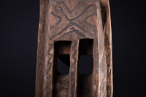 Lot 34 - A Dogon mask, Mali, surmounted by a large bird...