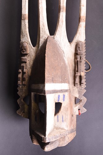 Lot 25 - A Dogon mask, Mali, with two tall central...