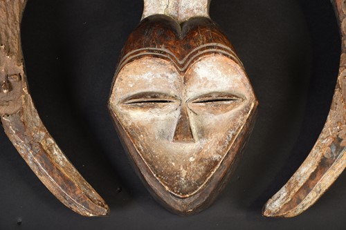 Lot 40 - A Kwele mask, Gabon, the mask with narrow eye...