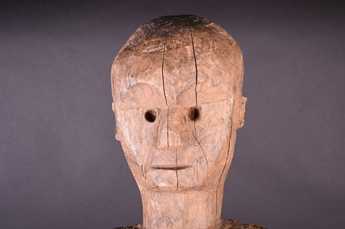 Lot 71 - A large African carved wood male fertility...