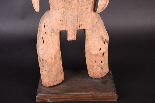 Lot 71 - A large African carved wood male fertility...
