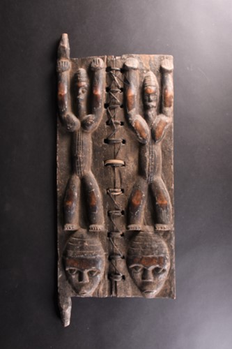 Lot 33 - A Baule attributed carved wood granary door,...