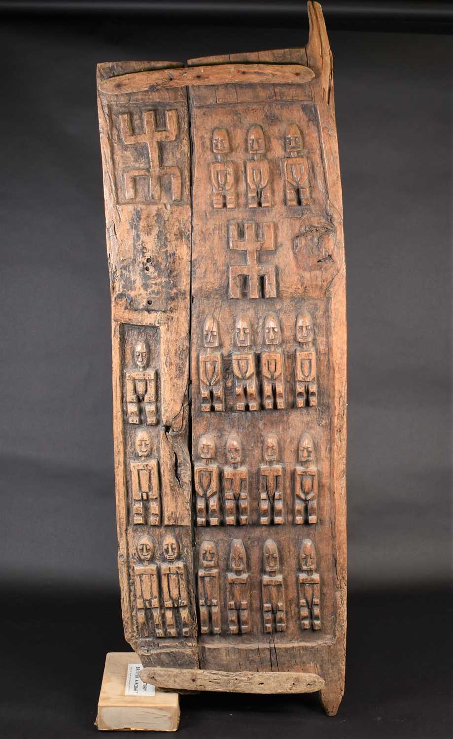 Lot 29 - A Dogon carved wood door, Mali, carved with...
