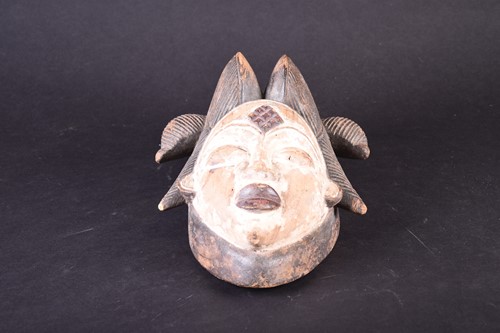 Lot 108 - A Punu mask, Gabon, with linear coiffure,...