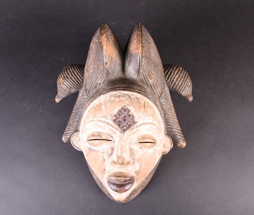Lot 108 - A Punu mask, Gabon, with linear coiffure,...