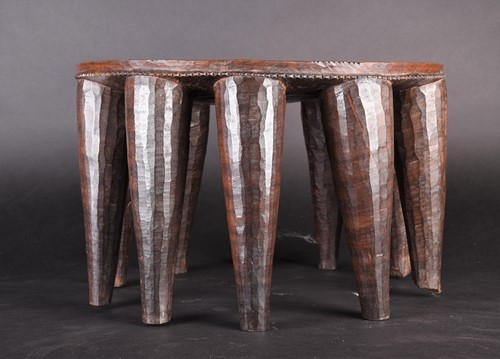 Lot 120 - A Nupe stool, Nigeria, the circular top with a...