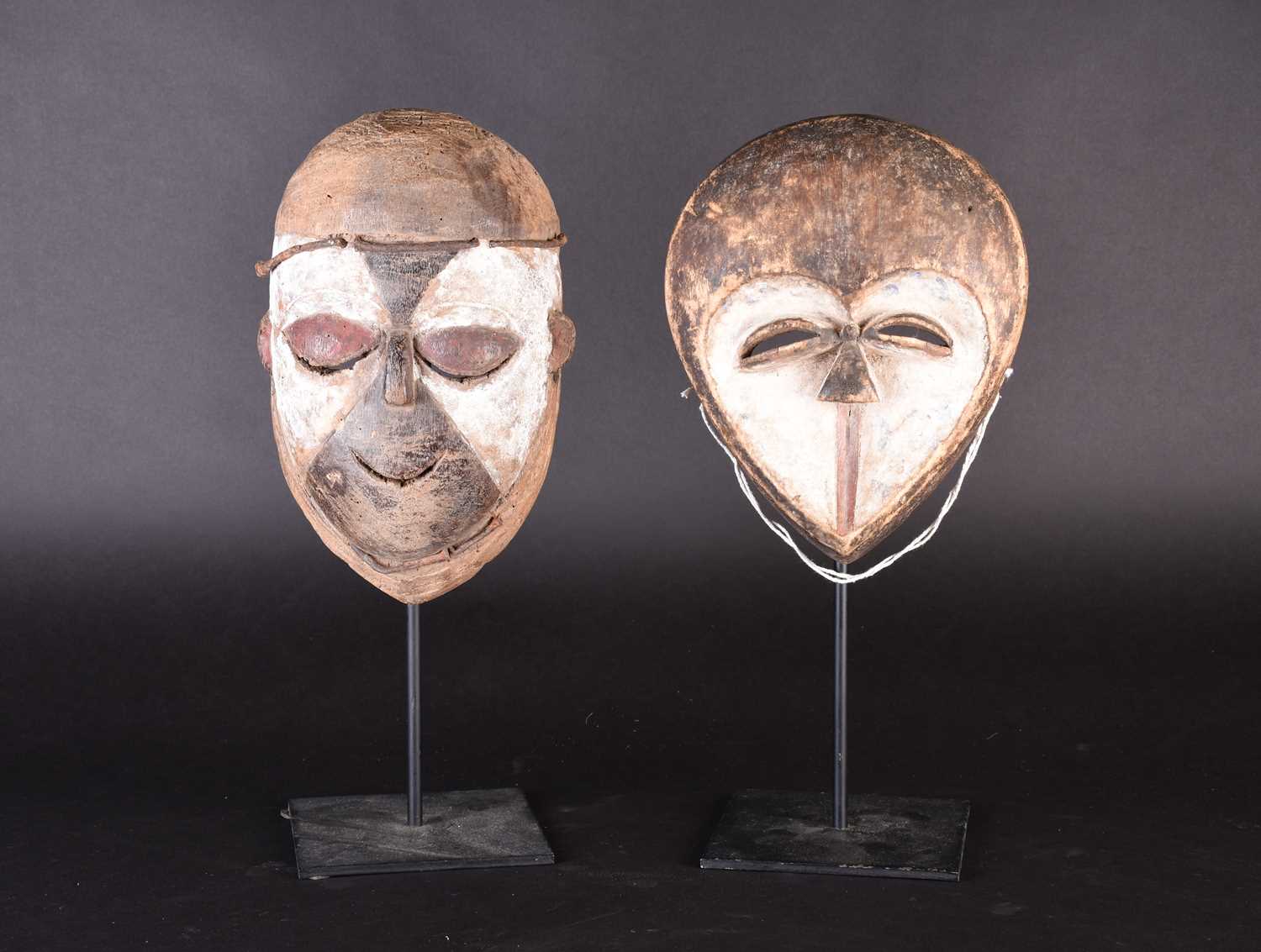 Lot 143 - Two African masks, a Kwele mask and a Galoa...