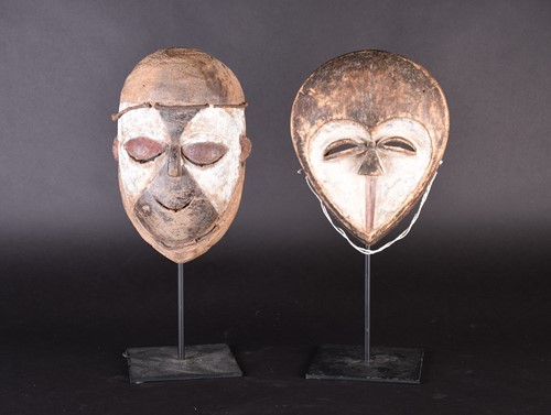Lot 143 - Two African masks, a Kwele mask and a Galoa...