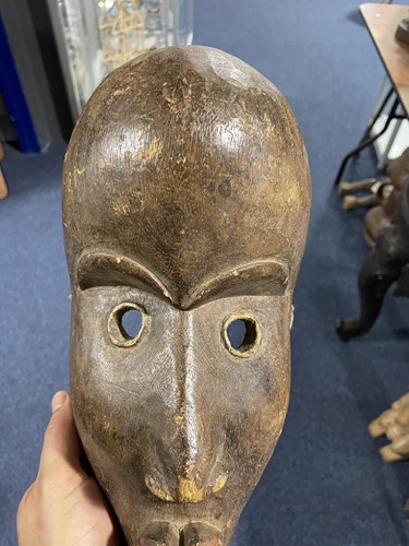Lot 130 - Two West African masks, possibly Dan, Ivory...