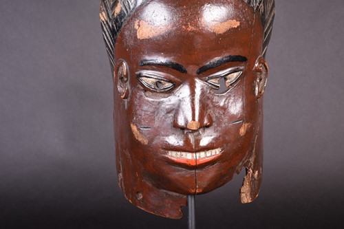 Lot 144 - A Nigerian painted mask, with geometric...