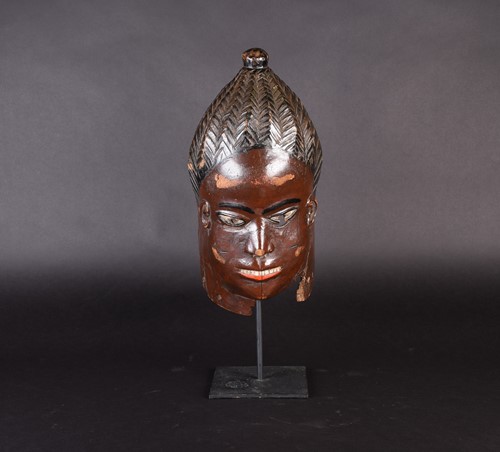 Lot 144 - A Nigerian painted mask, with geometric...