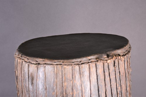Lot 97 - A West African freestanding drum, the wood...