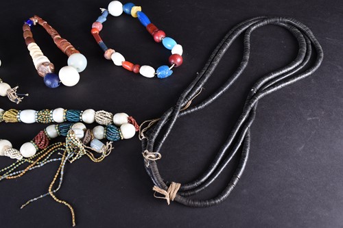 Lot 100 - African glass bead necklaces, comprising a...