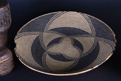 Lot 92 - A large South African woven straw shallow bowl,...