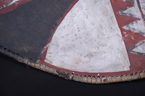 Lot 146 - A Maasai painted hide dance shield, Kenya, of...