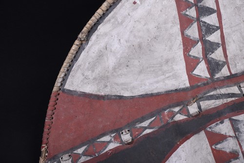 Lot 146 - A Maasai painted hide dance shield, Kenya, of...