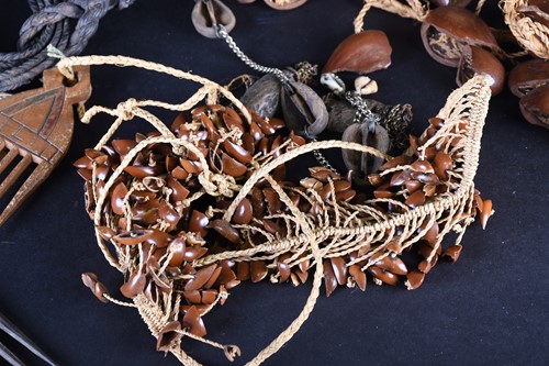 Lot 107 - African jewellery, comprising four seed pod...
