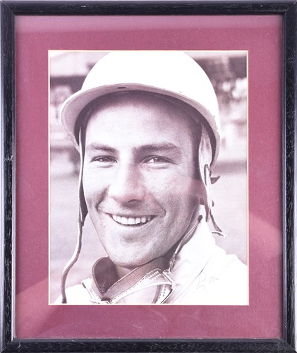 Lot 516 - Sir Stirling Moss (1929-2020), a signed black...