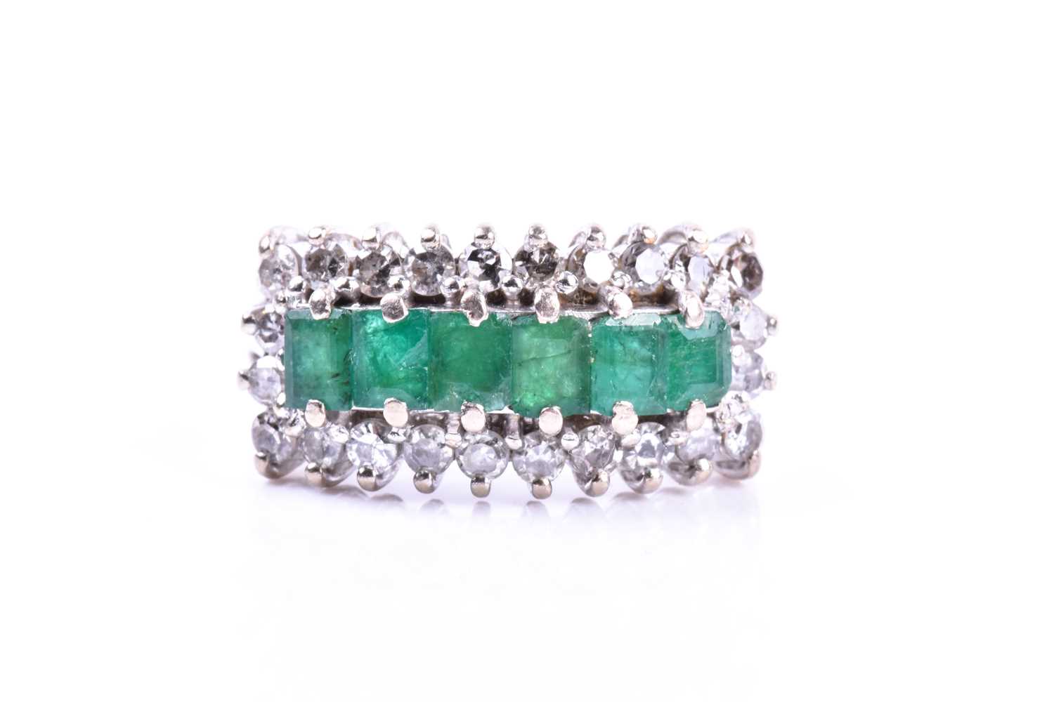 Lot 52 - A diamond and emerald ring, set with six mixed-...