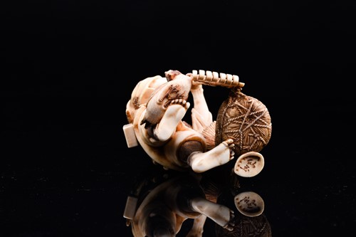 Lot 162 - A Japanese ivory okimono of a farmer, Meiji...