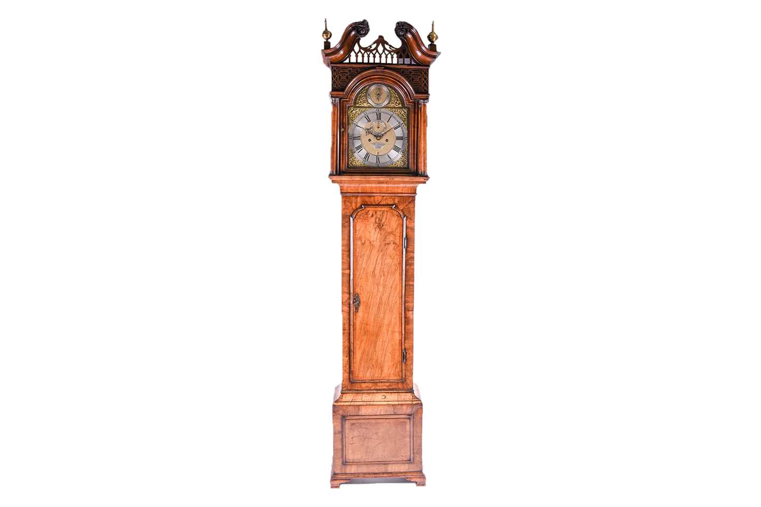 Lot 530 - A Georgian walnut long case clock, the arched...