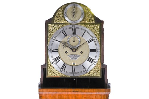 Lot 530 - A Georgian walnut long case clock, the arched...