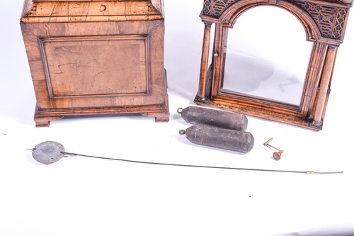 Lot 530 - A Georgian walnut long case clock, the arched...