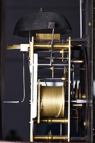 Lot 530 - A Georgian walnut long case clock, the arched...