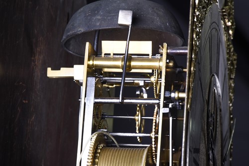 Lot 530 - A Georgian walnut long case clock, the arched...