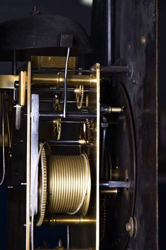 Lot 530 - A Georgian walnut long case clock, the arched...