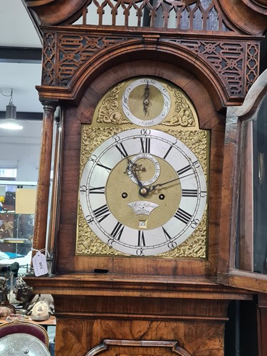 Lot 530 - A Georgian walnut long case clock, the arched...