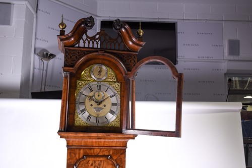 Lot 530 - A Georgian walnut long case clock, the arched...