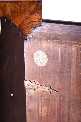 Lot 530 - A Georgian walnut long case clock, the arched...